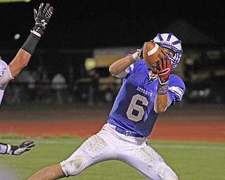 . ROBERT K. YOSAY | THE VINDICATOR..Wester Reserve #6 John Clegg takes in a pass to the three yard line during third quarter action and WR scored on the next play..Lowellville at Western Reserver