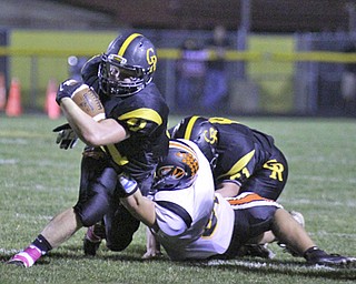 Crestview's Jake Ferris (41) stretches for a few extra yards before being brought down by Springfield's Mark Schuler (86) during the first quarter of Friday nights matchup at Crestview High School. Dustin Livesay | The Vindicator 10/11/13 Crestview High School.