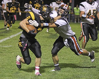 Trevor Cope (2) of Crestview breaks a tackle attempted by Anthony Scandy (7) of Springfield during the second quarter of Friday nights matchup at Crestview High School. Dustin Livesay | The Vindicator 10/11/13 Crestview High School.