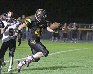 Crestview senior Jake Ferris (41) reaches the ball over the goal line after breaking through the Springfield defense in the closing minute of the first half during Friday nights matchup at Crestview High School in Columbiana. Dustin Livesay | The Vindicator 10/11/13 Crestview High School.