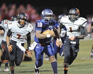 Fitch #18 Antwan Harris breaks away from Massillon defenders #7 Reggie Rogers and #1 Marcus Whitfield after breaking into the open field. He would score a touchdown on the play in the first quarter.
