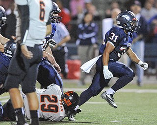 Fitch #31 Tyler Hewlett celebrates after a tackle in the backfield of Massillon running back #29 Lyron Wilson on a running play int he first quarter.