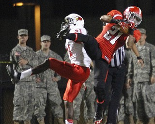 ROBERT K. YOSAY | THE VINDICATOR..Late in second quarter YSU #21 Dale Peterman interecepts the pass from #21 Chake Chatham on the YSU 9.. to stop the drive.. and YSU went on to score..YSU vs Illinois State.. - -30-..
