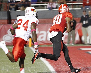 ROBERT K. YOSAY | THE VINDICATOR..YSU #80 Andrew Williams cradles the ball after a 40 yard pass from Hess...and goes in for the score with #24 Mike Banks.. YSU vs Illinois State.. - -30-..