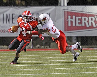 ROBERT K. YOSAY | THE VINDICATOR..YSU # 4 Andre Stubbs runs around carrying #22 Ezra Thompson and gains 27 yards on kickoff return.Illinois YSU vs Illinois State.. - -30-..