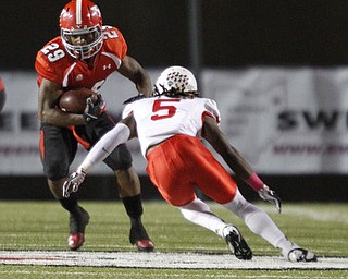 ROBERT K. YOSAY | THE VINDICATOR..YSU #29 Marin Ruiz puts a move on #5 Tevin Allen after gaining 17 yards and a first down..YSU vs Illinois State .. - -30-..