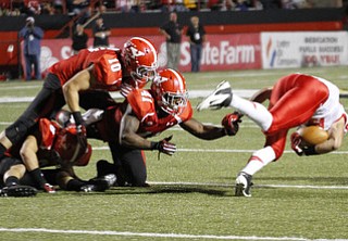 ROBERT K. YOSAY | THE VINDICATOR..after tripping up #80 James O'Shaughnessy #41 kevon Caffey #10 Ricky Davis adn Donald D'Alesio YSU vs Illinois State.. - -30-..