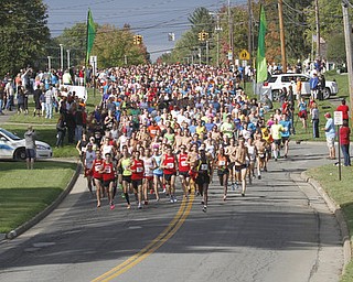 . ROBERT K. YOSAY | THE VINDICATOR..And they are off as the runners head east on Kirk Rd...The 39th Annual Peace Race - with over 2000 runners on a beautiful October day