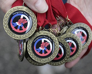 . ROBERT K. YOSAY | THE VINDICATOR..The new peace race medal that every runner received, that ran the 400m race .The 39th Annual Peace Race - with over 2000 runners on a beautiful October day