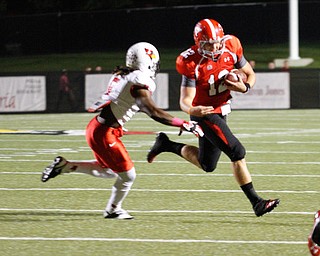 ROBERT K. YOSAY | THE VINDICATOR..Illinois State #5 Tevin Allen is pursuing YSU QB Kurt Hess as Kurt gained 5 yard during first quarter action.5YSU vs Illinois State.. - -30-..