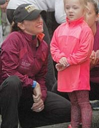 Madison Medvec, 4, of Struthers gets a pep talk from her aunt Terri Hrina-Treharn at Sunday’s Peace Race.
The day started with a 400-meter kids run at 9 a.m. and was followed by a two-mile run/walk that had 619
participants. In all, more than 2,000 participated Sunday.