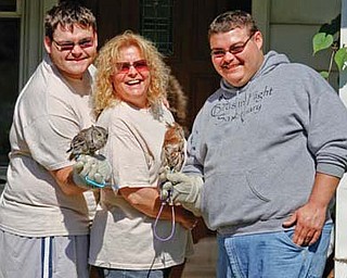 Cameron, Heather and Anthony Merritt, who have owned and operated Birds in Flight Sanctuary for 22 years.