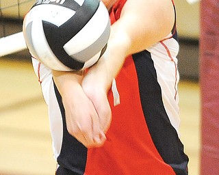 Fitch’s Sydney Greenwood bumps the ball over the net during Monday night’s game against Warren Harding at Stow High School. The Falcons won in four games.