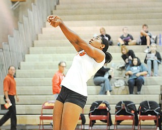Howland’s Christian Carr hits the ball back over the net during Monday night’s game against Twinsburg at Stow High School. The Tigers lost in three sets.