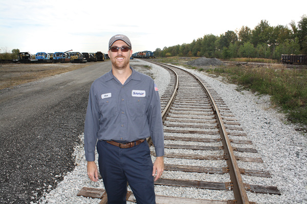 Matt McComber, operations manager at the Ohio Commerce Center in Lordstown for the company Savage, stands
on some of the new train tracks that have been installed at the center.