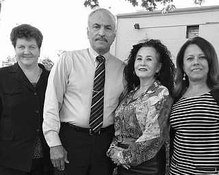 SPECIAL TO THE VINDICATOR
Hard at work preparing for the gala fundraiser planned by Hispanic American Civic and Cultural Organization are, from left, Susan Nieves, executive director; Hector Colon, event chairman; Minerva Colon, O.C.C.H.A. board president; and Dr. Consuelo Mendez, O.C.C.H.A. board member and event committee member.