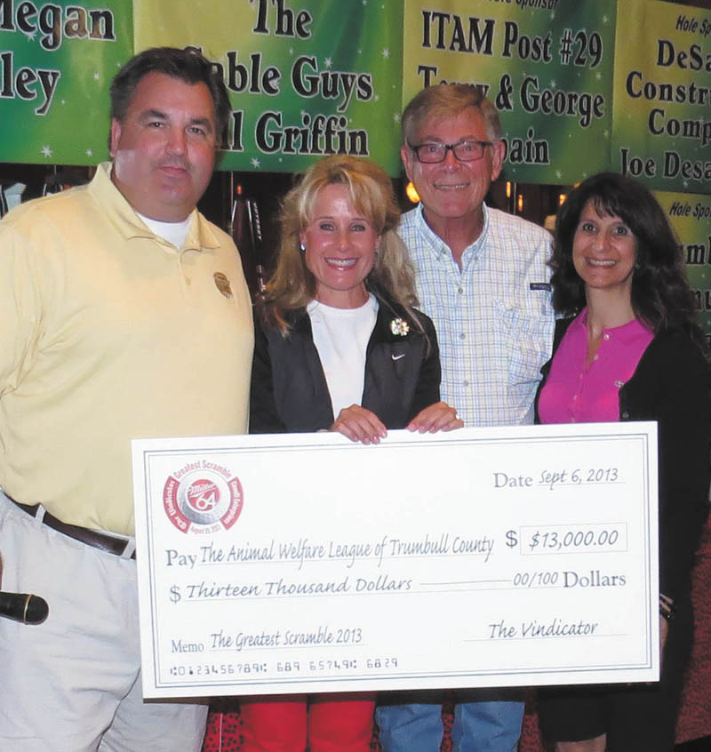 SPECIAL TO THE VINDICATOR
The Greatest Golfer of the Valley summer tournament Greatest Scramble proceeds of $13,000 were donated Sept. 6 to the Animal Welfare League of Trumbull County. Todd Franko, left, editor of The Vindicator, presented the check to, from left, Caryn Covelli, Dr. Rufus Sparks and Cindy D’Amico, board members of the Animal Welfare League, at the 15th annual golf outing at Squaw Creek Country Club. The money will be used to renovate the former Thunderplex indoor baseball complex in Vienna into a 47,000 square-foot animal shelter.