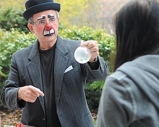 Jocko the Clown plays jokes on students as they wait in line at the Kilcawley Center at Youngstown State University Tuesday Morning.