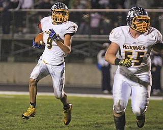 McDonald's Jake Reckard (9) follows Carson Williams (55) around the Lowellville defenders during the first quarter of Friday nights matchup at Lowellville High School.  Dustin Livesay  |  The Vindicator  10/18/13  Lowellville High School.