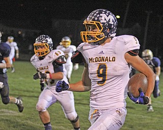 McDonald's Jake Reckard (9) waits for his blockers as he runs up the sidelines during the second quarter of Friday nights matchup against Lowellville at Lowellville High School.  Dustin Livesay  |  The Vindicator  10/18/13  Lowellville High School.
