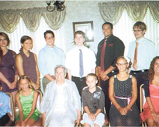 SPECIAL TO THE VINDICATOR

First Catholic Slovak Ladies Association, Youngstown District, recently presented scholarships to students in the diocese from parochial grade school through college. Twenty-five recipients received $30,000 in scholarships. Some of the recipients, seated from left, are Vincent Pezzuto, St. Rose School in Girard; Mya Agee, Holy Family in Poland; Bernadette Demechko, FCSLA Youngstown District president; Justin Viau, St. Pius X School in Baltimore, Ohio; Brooke Chandler, Holy Family; and Deanna Demechko, Hoban High School in Akron. Standing are Jessica Yuricek, Youngstown State University; Mara Bahmer, Hoban; Jacob Sebest, Ursuline High School; Jacob Zaluski, YSU; Derek Bodo, YSU; Robert Campati, University of Toledo; and Sean Petiya, Kent State University graduate school.