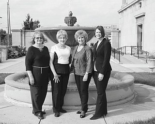 MADELYN P. HASTINGS | THE VINDICATOR
Above, from left, are Leilani Drake and Barbara Banks, Stambaugh Pillars fashion show co-chairwomen; Catherine Campana, president; and Katie Sprague, manager at Dillard’s, outside Stambaugh Auditorium to promote the annual Stambaugh Pillars Fashion Show.