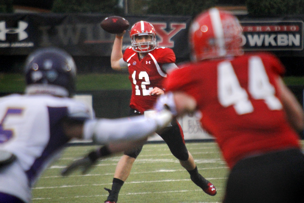 MADELYN P. HASTINGS | THE VINDICATOR..YSU's Kurt Hess (12) passes the ball during Youngstown's homecoming game against Western Illinois on October 19, 2013.... - -30-..