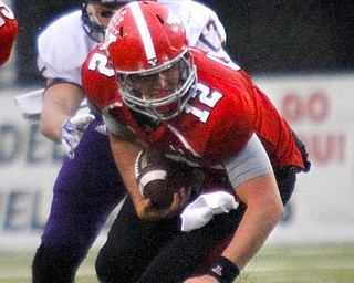 MADELYN P. HASTINGS | THE VINDICATOR..YSU's Kurt Hess (12) runs with the ball from Western Illinois' Kevin Kintzel (17) during Youngstown's homecoming game on October 19, 2013.... - -30-..