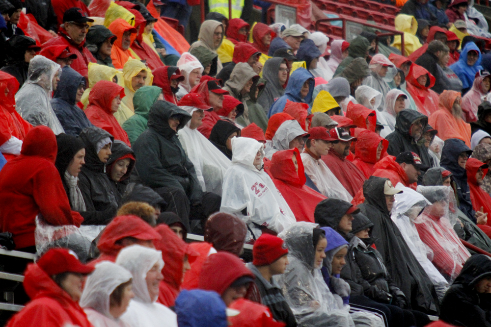 MADELYN P. HASTINGS | THE VINDICATOR..Visitors prepare for a rainy homecoming game at Stambaugh Stadium on October 19, 2013.... - -30-..