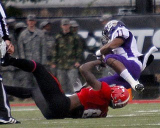 MADELYN P. HASTINGS | THE VINDICATOR..YSU's Travis Williams (6) brings down Western Illinois' Kyle Hammonds (11) during Youngstown's homecoming game on October 19, 2013.... - -30-..