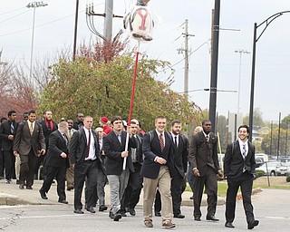The Youngstown State football team crosses Fifth ave. after walking through the tailgate lots before the start of the Homecoming parade on Saturday.  Dustin Livesay  |  The Vindicator 10/19/13  Youngstown.