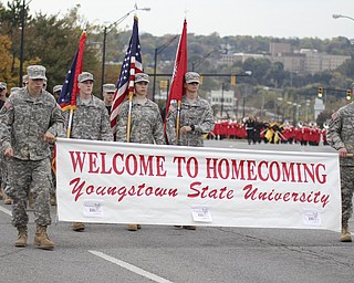 Members of the Youngstown State ROTC carry the homecoming banner at the start Homcoming parade on Saturday afternoon.  Dustin Livesay  |  The Vindicator 10/19/13  Youngstown.