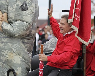 Youngstown State president Randy Dunn waves to spectators during the Homecoming parade on Fifth Ave. in Youngstown. Dustin Livesay  |  The Vindicator 10/19/13  Youngstown.