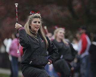 Youngstown State Penguinette Erika Aulizia twirls her baton during the Homecoming parade on Fifth Ave. in Youngstown on Saturday. Dustin Livesay  |  The Vindicator 10/19/13  Youngstown.