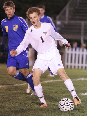 William D Lewis The Vindicator South Ranges (1) and Lake Center's (3) battle for the ball during  Tuesday action at SR.