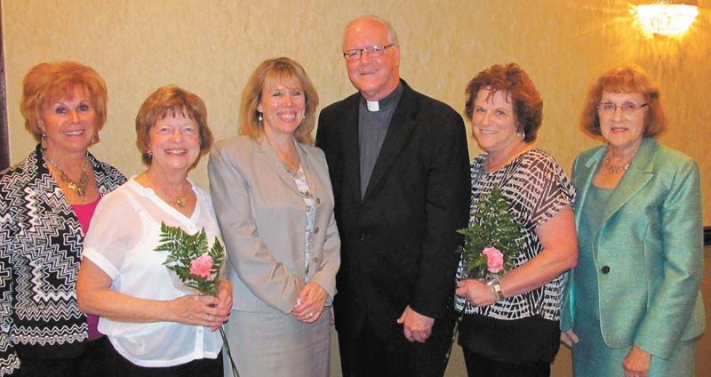 SPECIAL TO THE VINDICATOR
The fall meeting of Catholic Collegiate Association recently took place at the Holiday Inn in Boardman. Ellen Sandel and Jeanne Pepperney were welcomed as new members. Speakers were The Rev. Richard Murphy, president of Ursuline High School, and Dr. Lois Cavucci, president of Lumen Christi. Above, from left, are Cathy Campana, president of CCA; Pepperney; Dr. Cavucci; the Rev. Mr. Murphy; Sandel; and Barbara Banks, vice president of CCA.