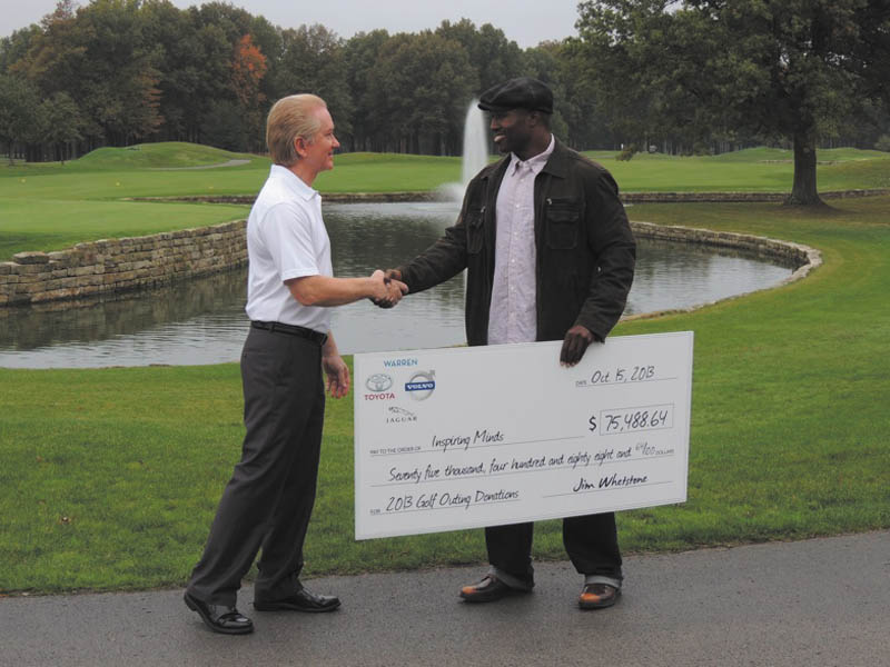 SPECIAL TO THE VINDICATOR
Jim Whetstone, left, owner of Toyota of Warren, recently presented a check for $75,488.64 to Deryck Toles, executive director of Inspiring Minds. The proceeds were earned at the second annual Celebrity Golf Outing in June at Avalon Lakes in Warren. Toles founded Inspiring Minds seven years ago to inspire and empower young people to overcome obstacles in their lives. More than 200 have enrolled in its summer enrichment program.
