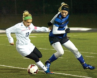 Canfield senior Elena Billy fights to maintain control of the ball against Lakeview defender Allison Pavlik during the Division II district soccer final Thursday on Bob Dove Field at Cardinals Stadium in Canfield. The Cardinals dominated the Bulldogs, 6-1, behind the their defense and Paige Bidonatto, who scored three goals. 
