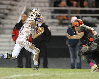 Reserve receiver #5 Danny Rosati runs in the open field before being tackled by Ridge #2 Jonathan Baker.