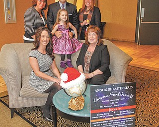 ROBERT K. YOSAY | THE VINDICATOR
Angels of Easter Seals is preparing for the 27th annual Magic of the Angels’ Christmas benefit set for Nov. 23 at Mr. Anthony’s in Boardman. In front, from left, are Christa Blasko, marketing director of Eastwood Mall; Cyprus Blosser, child representative; and Kathy Carroll, president. Standing are Shelly LaBerto, co-chair; Mike Case, master of ceremonies; and Carolyn Leetch, co-chair.