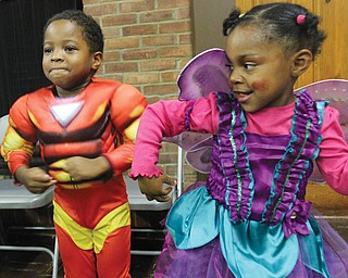 Jeremiah Robinson, 4, and Eleya Johnson, 3, dance during Black Knights Halloween event Wed at Wick Park.