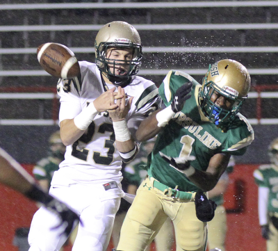 William D LEwis The Vindicator Ursuline's Ben Phillips(1) losses control of a pass while  SVSM's Nathan Bischof(23) defends during 1rst qtr action Thursday 10-31-13 at YSU.