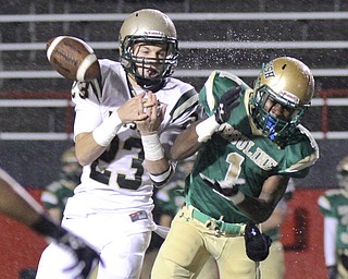 William D LEwis The Vindicator Ursuline's Ben Phillips(1) losses control of a pass while SVSM's Nathan Bischof(23) defends during 1rst qtr action Thursday 10-31-13 at YSU.