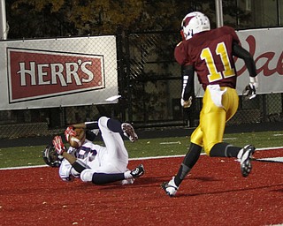 . ROBERT K. YOSAY | THE VINDICATOR..#9 Fitch Joey Harrington brings in a TD pass during second quarter action - as #11 Mooney Roosevelt Cooper looks on ..Austintown Fitch @ Mooney at Stambaugh Stadium