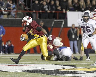 . ROBERT K. YOSAY | THE VINDICATOR..Mooneys 32 C J Amill breaks throught the line for a first down during first quarter action ..Behind him is Fitch #76 Tony Behanna and #6 Mooney Brandon Berry.. Austintown Fitch @ Mooney at Stambaugh Stadium