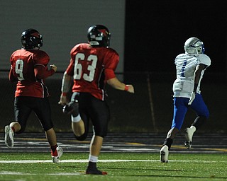 Hubbard #1 Darnell Tate sprints into the end zone to score on a pick six beating Canfield #9 Kimu Kim and #63 Ryan Housteau during the 2st quarter of Friday nights game.