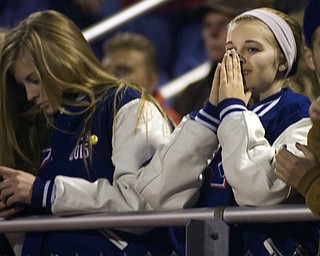 Kelli Cardinal/The Vindicator .Sabrina Miller, a junior at Western Reserve, watches the second quarter Friday night against Wellsville defenders on the Blue Devils field in Berlin Center.