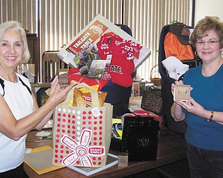 SPECIAL TO THE VINDICATOR
The ladies of the Trumbull County Medical Society Alliance are preparing baskets for Trumbull Mobile Meals Denim & Diamonds Basket Extravaganza, which will take place from 6 to 10 p.m. Saturday at Packard Music Hall, 1703 Mahoning Ave. NW, Warren. Doors will open at 5:30. Tickets can be purchased by calling TMM at 330-394-2538 or stop at the office at 323 E. Market St., Warren. Above, from left, are society members Carol Olson and Kay James. The event also will feature silent and basket auctions and foods from area restaurants. There will be a chance to win $6,000 worth of blue and white diamonds.