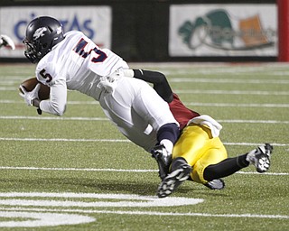 . ROBERT K. YOSAY | THE VINDICATOR..Austintown Fitch @ Mooney at Stambaugh StadiumFitchs #5 Kerrell Johnson pulls in a pass at the sidelines for a first down as Mooneys #11 Roosevelt Cooper brings him down