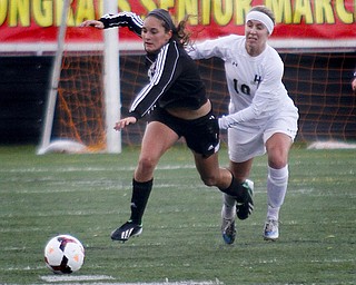 MADELYN P. HASTINGS | THE VINDICATOR..Canfield's Cheyenne Story (4) and Hathaway Brown's Melissa Vajskop (10) fight for the ball during their game at Brecksville-Broadview Heights High School on November 2, 2013. ... - -30-..